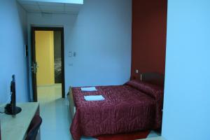 Voodi või voodid majutusasutuse Albergo Ma.Re toas