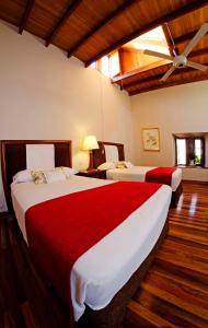 En eller flere senger på et rom på Casa Hacienda San Jose