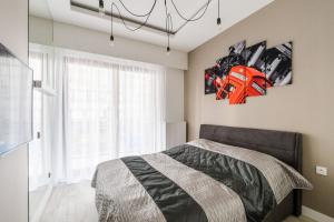 Łóżko lub łóżka w pokoju w obiekcie Exclusive Trendy Apartments