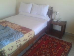 Postel nebo postele na pokoji v ubytování Hotel Almanader