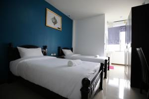 Un pat sau paturi într-o cameră la SABUN-NGA HOSTEL