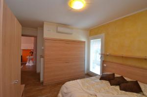 Postel nebo postele na pokoji v ubytování Garda Dream