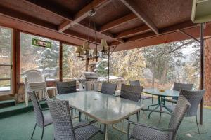 a dining room with a table and chairs at Mountain Haven Plus Loft in Raymond