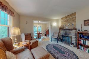 a living room with a couch and a fireplace at Hummingbird Hideout in Estes Park