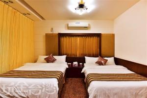Säng eller sängar i ett rum på Shanshui Hai An Homestay