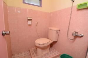 a bathroom with a toilet in a shower stall at Villa Amanah in Batu +9 photos