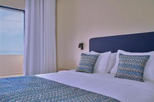 Posteľ alebo postele v izbe v ubytovaní Silver Beach Hotel & Apartments