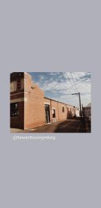 two photographs of a building and a street at THE WAREHOUSE APARTMENTS in Geelong