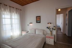 Ένα ή περισσότερα κρεβάτια σε δωμάτιο στο Villa Sinialo