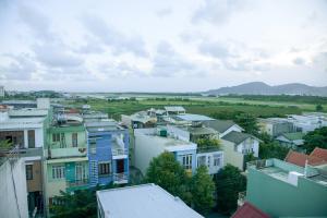 a view of a town with houses and a field at Hoang Thuy Sinh Hotel in Danang