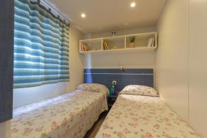 A bed or beds in a room at Campeggio Boscoverde