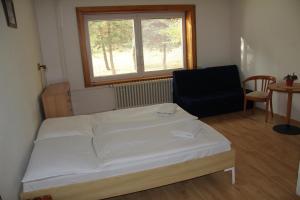 Postel nebo postele na pokoji v ubytování Holiday Park Vrchlabí - Liščí farma