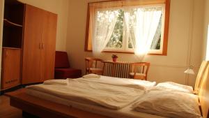 Postel nebo postele na pokoji v ubytování Holiday Park Vrchlabí - Liščí farma