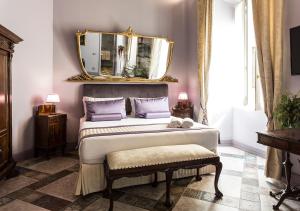 Televízia a/alebo spoločenská miestnosť v ubytovaní Navona Grand Suite