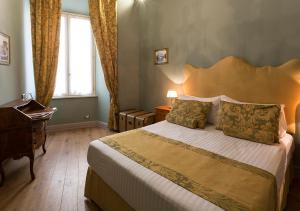 Posteľ alebo postele v izbe v ubytovaní Navona Grand Suite