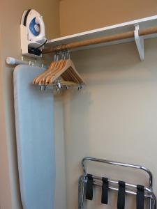 
a towel hanging from the ceiling of a bathroom at SureStay Hotel by Best Western North Vancouver Capilano in North Vancouver

