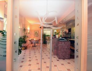a glass door to a room with a dining room at Residence Villa Gloria in Borgio Verezzi +169 photos
