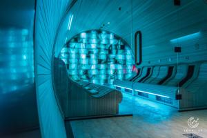a room with a chair in a building with a window at Domaine Des Hautes Fagnes in Ovifat