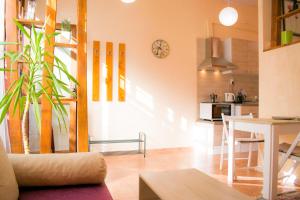 a living room with a table and a kitchen at 4 Seasons apartments, A1 in Plovdiv