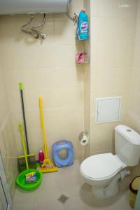 a bathroom with a toilet and tools in it at 4 Seasons apartments, A1 in Plovdiv
