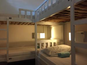 a couple of bunk beds in a room at Royal Hostel Singapore in Singapore