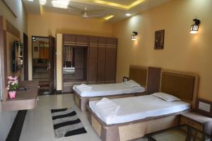 Letto o letti in una camera di Shree Ramkrishna Anandvan