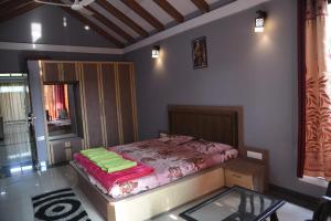 Letto o letti in una camera di Shree Ramkrishna Anandvan