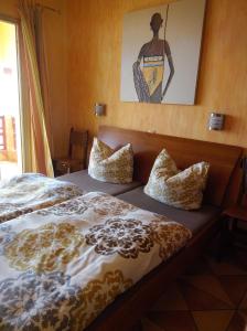 a bedroom with two beds and a picture on the wall at *****Finca Bella Vista in Arucas +30 photos