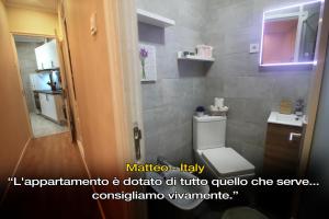 a bathroom with a toilet and a sink at LivingPorto Boavista in Porto +25 photos