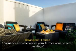 a group of chairs sitting on a patio at LivingPorto Boavista in Porto