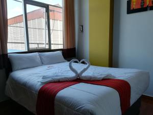 Postel nebo postele na pokoji v ubytování Pumas Cusco Hotel