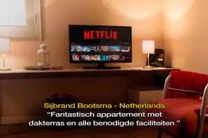 a flat screen tv sitting on a counter in a room at LivingPorto Boavista in Porto