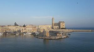 a group of buildings in a body of water at Casa Vacanze Belleville in Trani