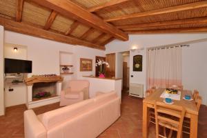 A television and/or entertainment centre at Villa Isuledda Beach