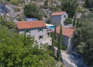 an aerial view of a house on a mountain at Villa Nidus Onei in Omiš