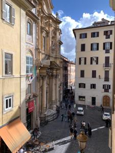 a group of people walking around a city street at Charme & Chic Luxury in Rome