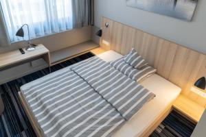 Postel nebo postele na pokoji v ubytování Hotel Lumi
