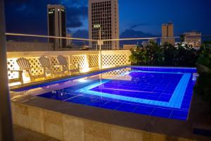 a swimming pool on the roof of a building at Casa Villa Colonial By Akel Hotels in Cartagena de Indias
