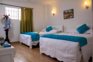 Postel nebo postele na pokoji v ubytování Casa Villa Colonial By Akel Hotels