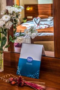 Posteľ alebo postele v izbe v ubytovaní Patak Park Hotel Visegrád