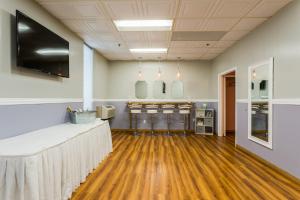 a dining room with a table and stools at Harbor Shores on Lake Geneva in Lake Geneva