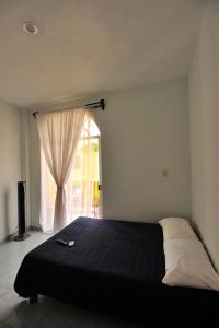 Ένα ή περισσότερα κρεβάτια σε δωμάτιο στο Bungalows de KQ