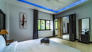 Sunset Paradise Villa客房内的一张或多张床位