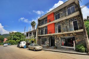 a car parked in front of a building at Bungalows de KQ in Xilitla