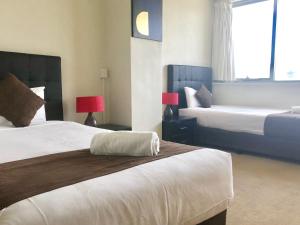 Postel nebo postele na pokoji v ubytování Parkdale Motor Inn