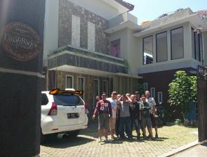 a group of people standing in front of a house at Umah Bagus in Sanur