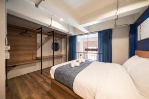 Letto o letti in una camera di Natee Hostel