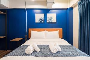 Letto o letti in una camera di Natee Hostel