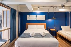 Letto o letti in una camera di Natee Hostel