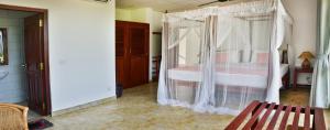 Postel nebo postele na pokoji v ubytování Villa Gamini